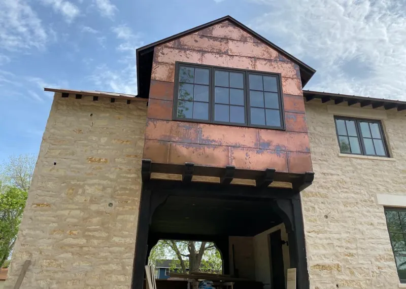 Copper metal panel facade on a stone building for Metal Roof Coating in Grayson Valley