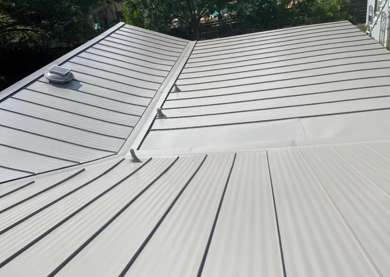 Solar attic fan installed on a metal roof for Roof Ventilation in Grayson Valley